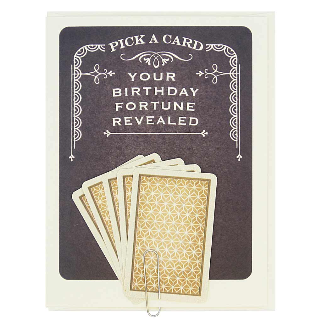 This card says Pick A Card… Your Birthday Fortune Revealed, and has 5 tiny playing cards to choose from attached to the front of the card with a paperclip. Pick one to reveal the future. All fortunes are bright and cheery. Card measures 4¼” x 5½”, comes with a cream envelope & is blank inside.