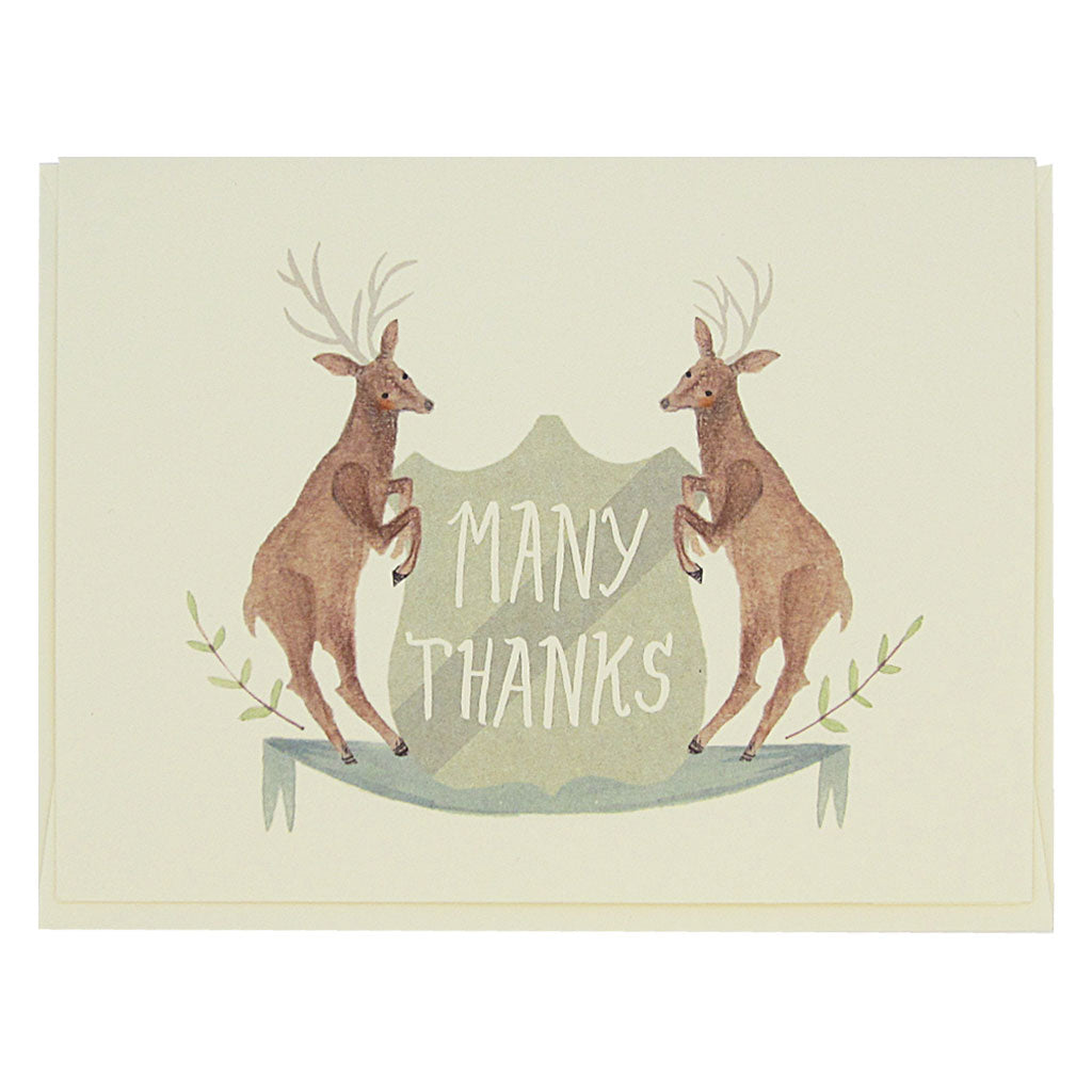 This beautiful thank you card features a watercolour painting of two deer on either side of a crest that reads ‘Many Thanks’. Card measures 4¼” x 5½”, comes with a cream envelope & is blank inside. Designed by The Regional Assembly of Text.