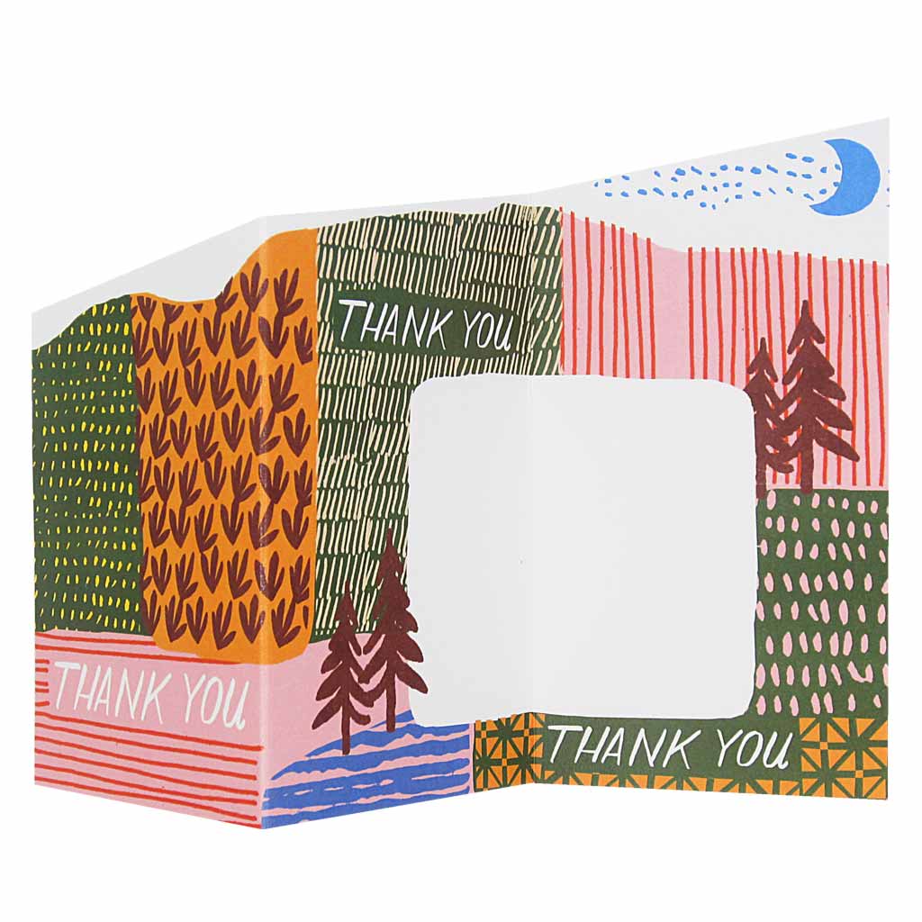 This sweet little accordian thank you card unfolds into a pretty, colourful landscape with space to write a heartfelt message. Measures 3” x 5½” and comes with an orange envelope. Designed by The Regional Assembly of Text.