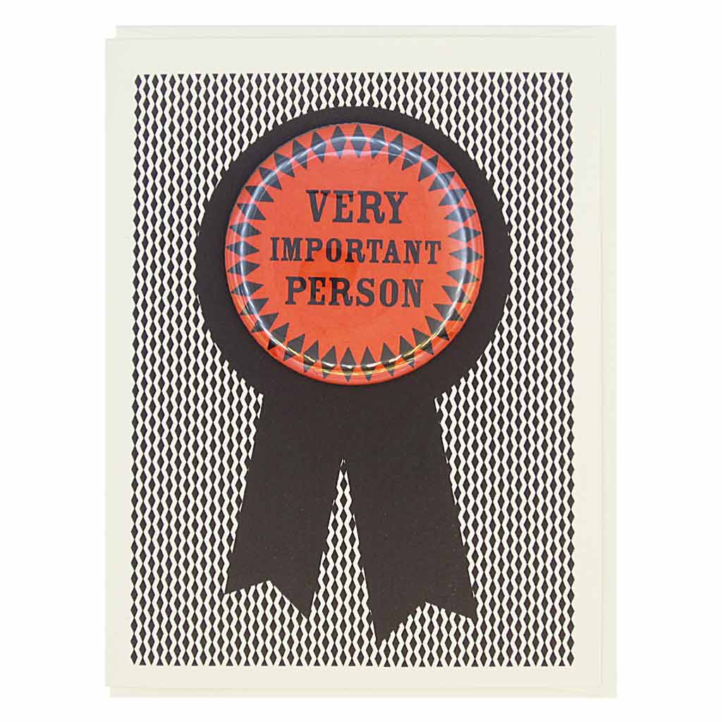 This greeting card looks like a prize ribbon. Features a 2¼” button with the text ‘Very Important Person’ that can be taken off and proudly worn by the recipient. Card measures 4¼” x 5½”, comes with a cream envelope & is blank inside. Designed by The Regional Assembly of Text.