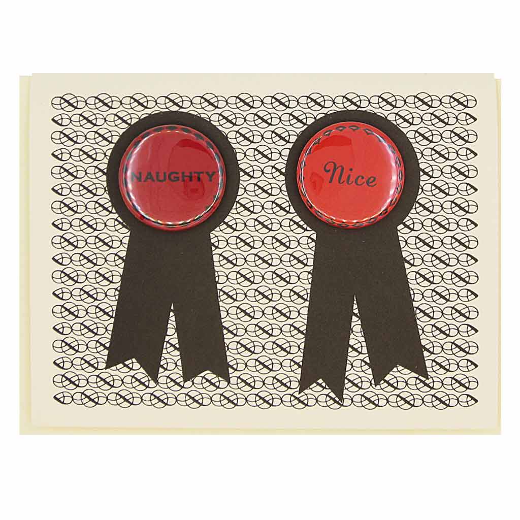 Opposites attract. Features two 1¼” buttons, one that says "Naughty" and the other says "Nice", that can be taken off and proudly worn by the recipients. Card measures 4¼” x 5½”, comes with a cream envelope & is blank inside.