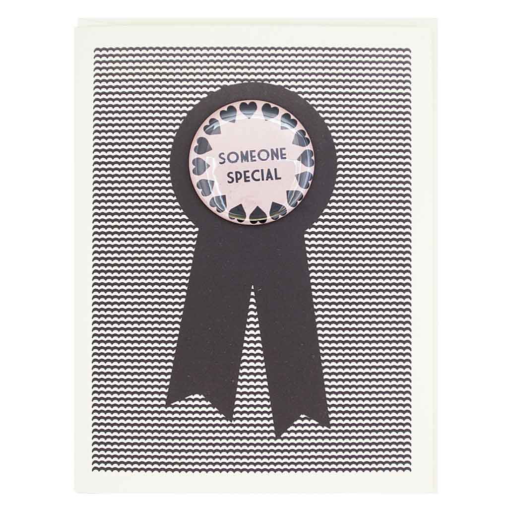 This greeting card is designed by The Regional Assembly of Text in Vancouver B.C. Canada. We retail and wholesale our greeting cards. Features a 1½” button that says Someone Special that can be taken off and proudly worn by the recipient. Card measures 4¼” x 5½”, comes with a cream envelope & is blank inside.