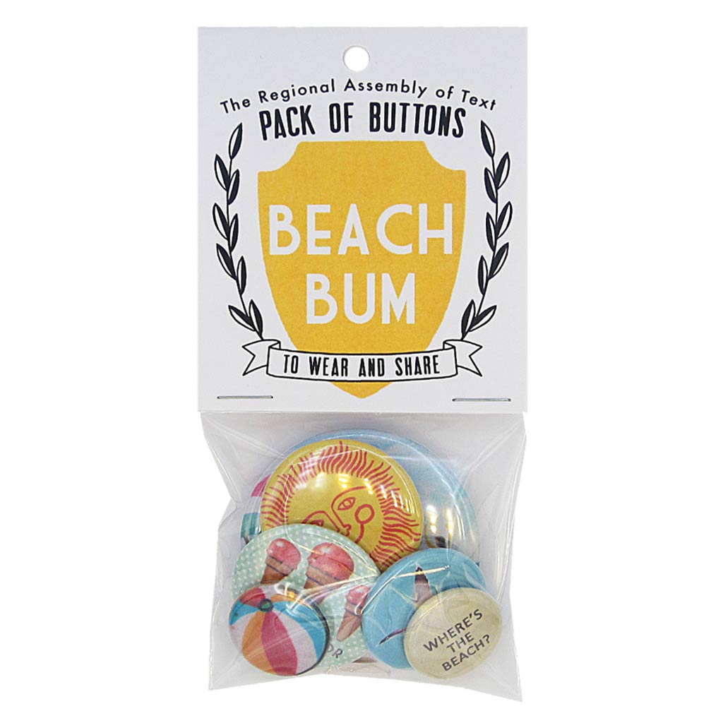 This pack of buttons has 6 buttons of varying sizes. Button images include: ice cream cones, beach ball, sun, seagull, beach umbrella and a button with the text “Where’s the beach?” Designed by The Regional Assembly of Text