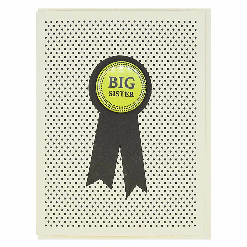 This card looks like a prize ribbon. Features a 1¼” button with the text ‘Big Sister’ that can be taken off and proudly worn by the recipient. Card measures 4¼” x 5½”, comes with a cream envelope & is blank inside. Designed by The Regional Assembly of Text.