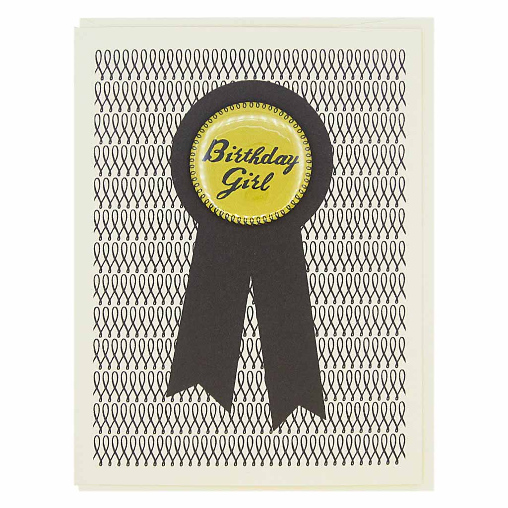 This birthday card looks like a prize ribbon. Features a 1½” button with the text ‘Birthday Girl’ that can be taken off and proudly worn by the recipient. Card measures 4¼” x 5½”, comes with a cream envelope & is blank inside.