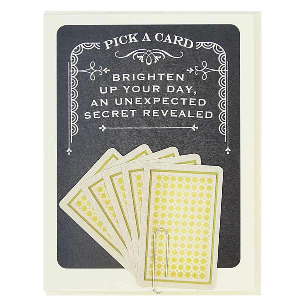 This greeting card says Pick A Card… Brighten Up Your Day, An Unexpected Secret Revealed, and has 5 tiny playing cards to choose from attached to the front of the card with a paperclip. Pick one to reveal the future. All fortunes are bright and cheery. Card measures 4¼” x 5½”, comes with a cream envelope & is blank inside. Designed by The Regional Assembly of Text.