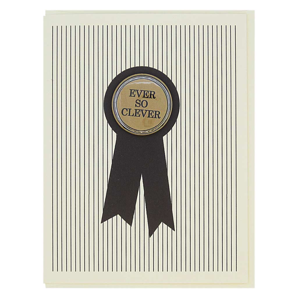 This card looks like a prize ribbon. Features a 1¼” button with the text ‘Ever So Clever’ that can be taken off and proudly worn by the recipient. Card measures 4¼” x 5½”, comes with a cream envelope & is blank inside. Designed by The Regional Assembly of Text.