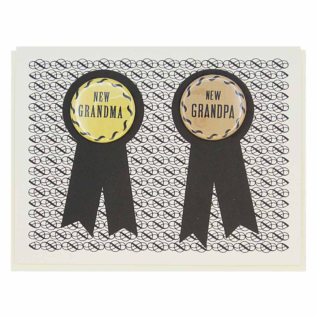This card has two prize ribbons side by sided and features two 1¼” buttons that can be taken off and worn by the recipients. They say ‘New Grandma’ and ‘New Grandpa’. Let us know during checkout if you need 2 new grandmas or 2 new grandpas instead. Card measures 4¼” x 5½”, comes with a cream envelope & is blank inside. Designed by The Regional Assembly of Text.