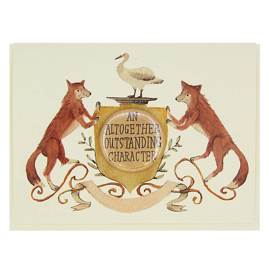 This lovely card features a watercolour painting of two red foxes on either side of a crest. There is a 1½” button in the middle of the crest that reads ‘an altogether oustanding character’. The button can be taken off and worn by the recipient. Card measures 4¼” x 5½”, comes with a cream envelope & is blank inside. Designed by The Regional Assembly of Text.