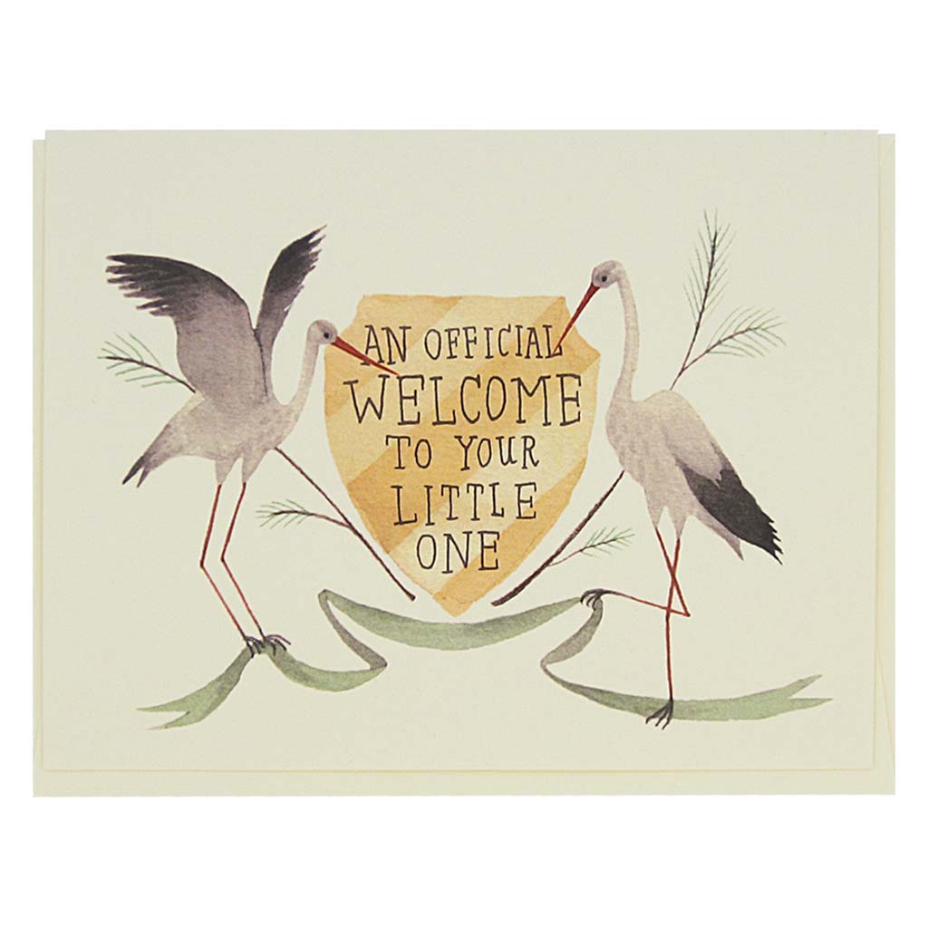 This beautiful new baby card features a watercolour painting of two storks on either sided of a crest which reads ‘an official welcome to your little one’. Card measures 4¼” x 5½”, comes with a cream envelope & is blank inside. Designed by The Regional Assembly of Text.