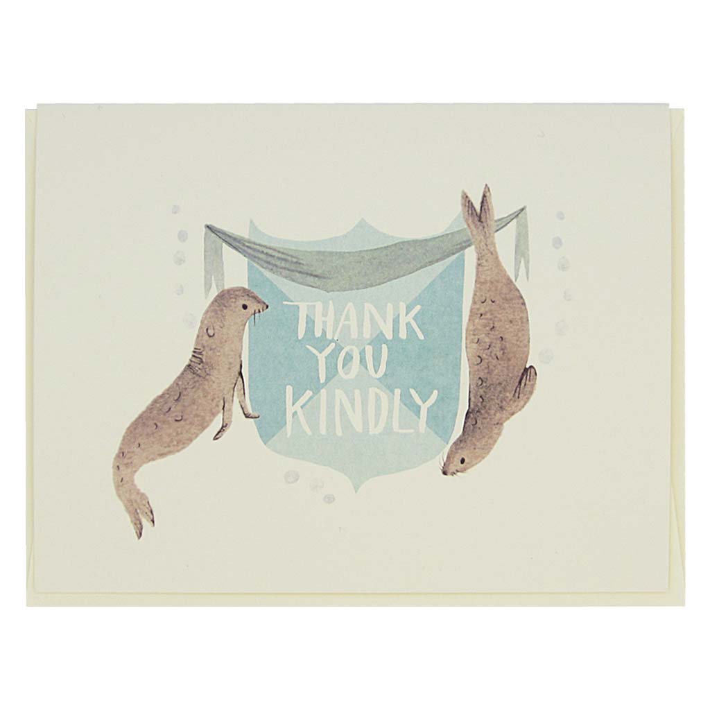 This beautiful thank you card features a watercolour painting of two seals on either side of a crest that reads ‘Thank You Kindly’. Card measures 4¼” x 5½”, comes with a cream envelope & is blank inside. Designed by The Regional Assembly of Text.