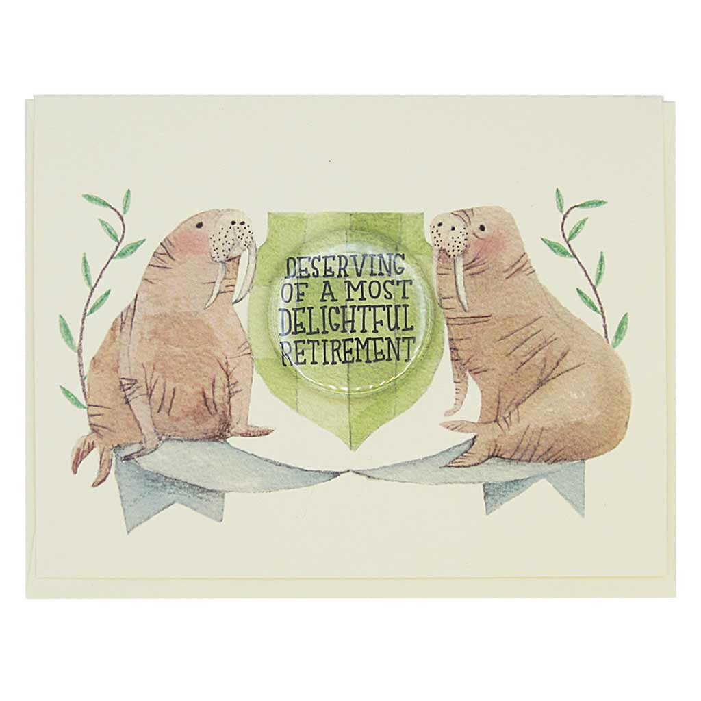 This beautiful retirement card features a watercolour painting of two walruses on either side of a crest. There is a 1½” button in the middle of the crest that reads ‘Deserving a Most Delightful Retirement’. The button can be taken off and worn by the recipient. Card measures 4¼” x 5½”, comes with a cream envelope & is blank inside. Designed by The Regional Assembly of Text.
