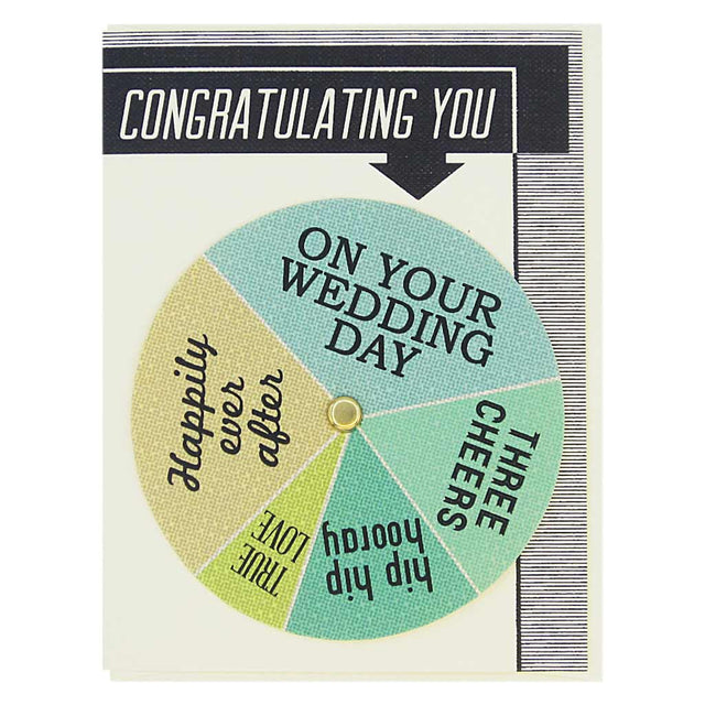 This wedding card has text at the top that says ‘Congratulating You’ and an arrow pointing to a colourful wheel that you can spin to select different sentiments including…’Happily Ever After, Hip Hip Hooray, True Love’. Card measures 4¼” x 5½”, comes with a cream envelope & is blank inside. Designed by The Regional Assembly of Text.