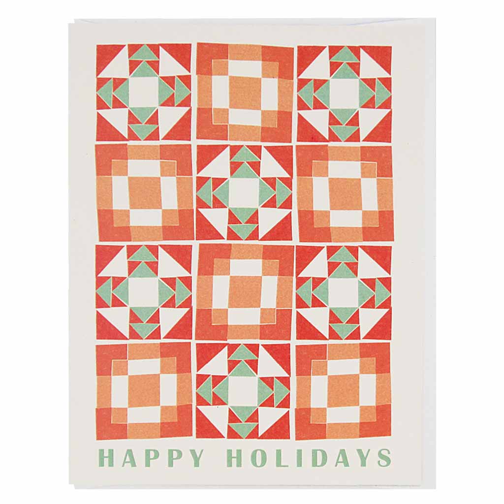 A cheery little holiday card that looks like a vintage quilt pattern with the words "happy holidays" at the bottom.Measures 4¼” x 5½”, comes with a white envelope & is blank inside.